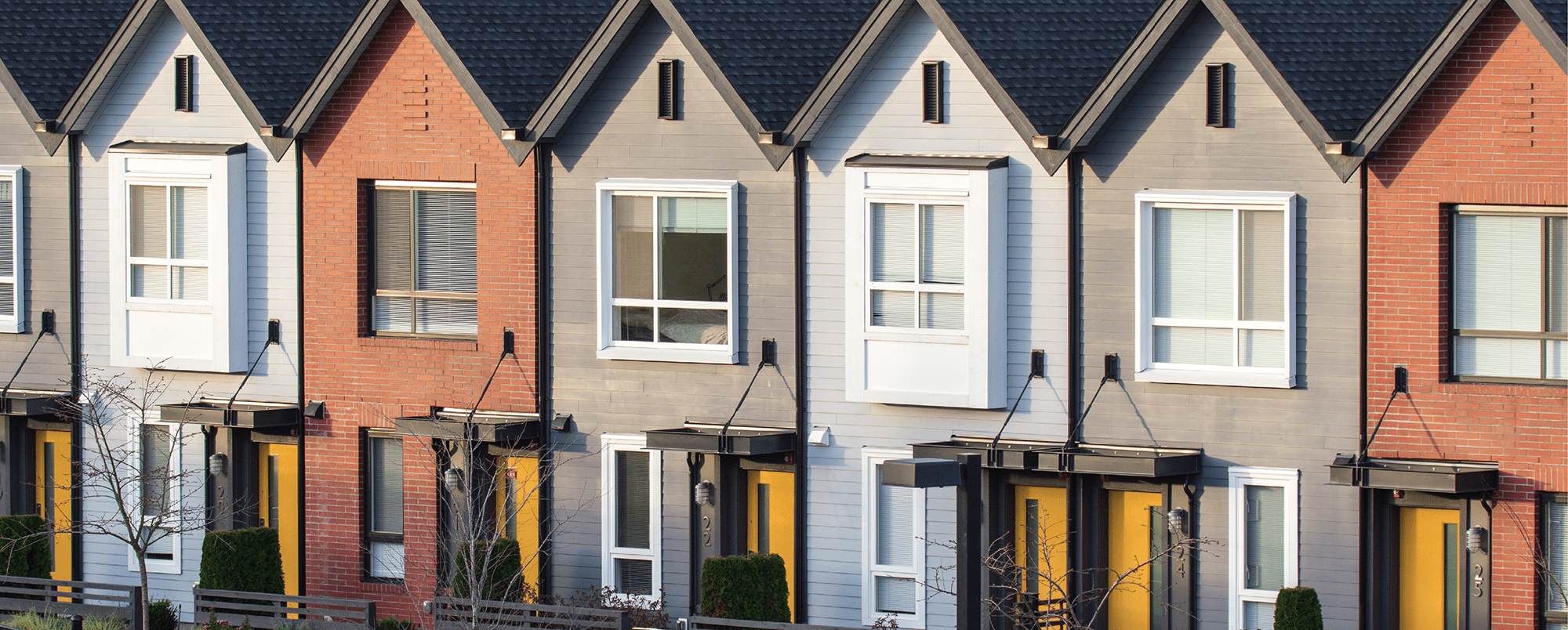 Image of newly-built townhomes in a row