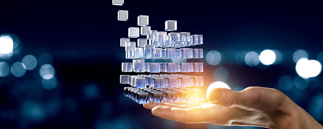 AdobeStock 332115302 Hand holding glowing cubes. Innovation and creativity concept Header